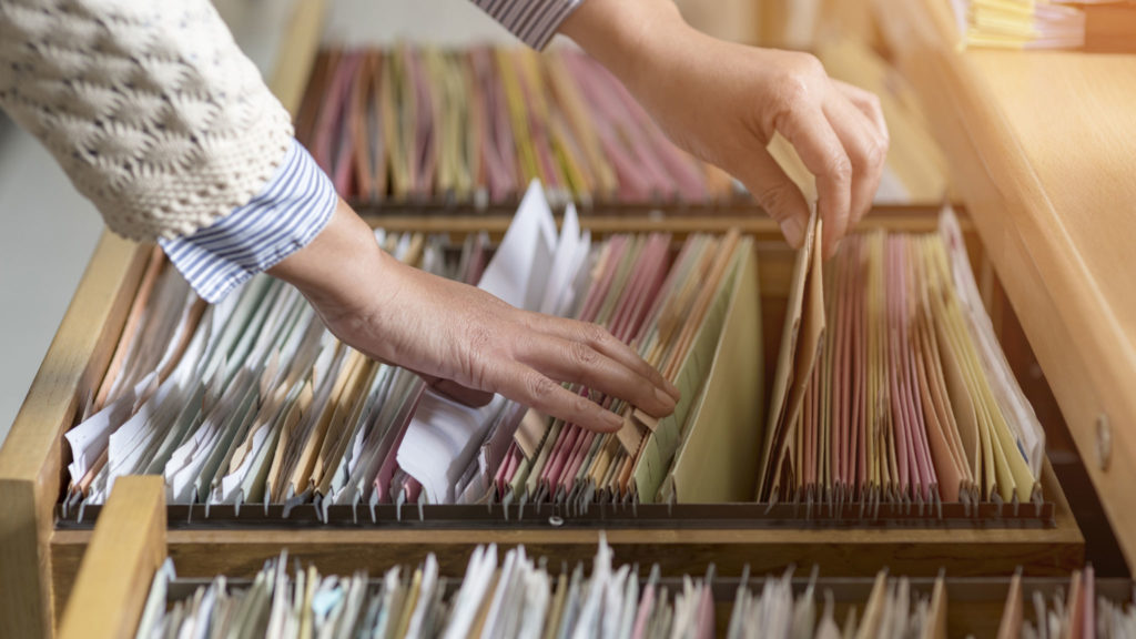as-filing-paperwork-by-hand-office-administrative-staff-clerical-work