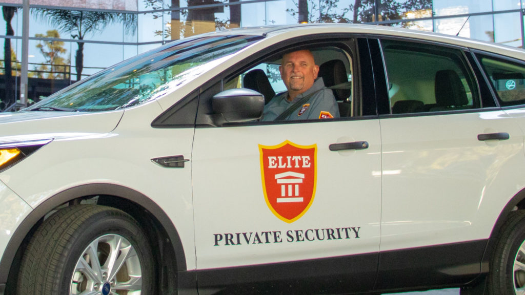 Security Patrol Guard at wheel of fleet vehicle