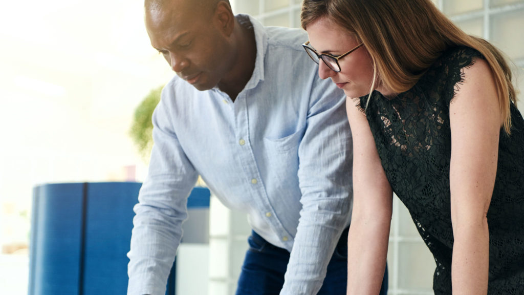 Two people consulting on specialized security services